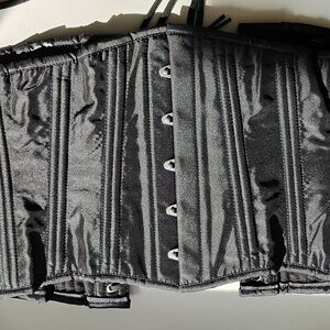 Plain black cotton corset with metal boning and modesty panel.